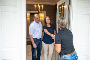 service tech at the front door of home