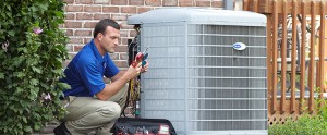 A technician performing AC repair in Gainesville, Florida