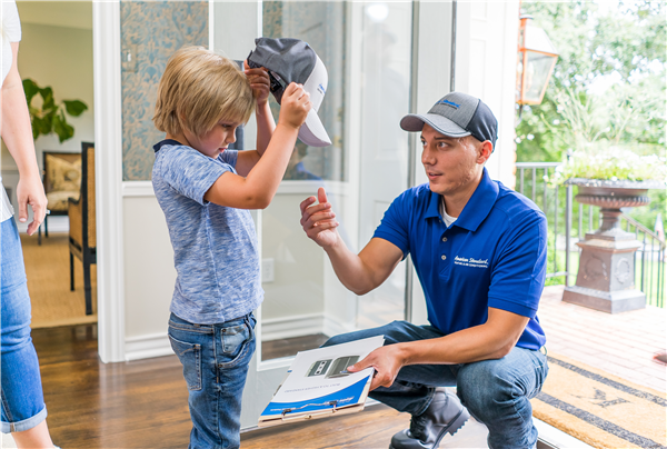 A kid and an HVAC professional | HVAC Company Gainesville